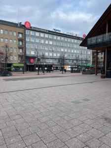 a large building with a clock on the top of it at Top location in Joensuu in Joensuu +3 photos