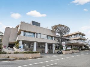 a building on the side of a street at Hitachi Ocean View HOTEL and RESORT in Hitachi