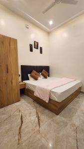 a bedroom with a large bed in a room at Hotel RK Heritage in Varanasi
