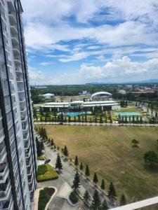 an aerial view of a building and a park at Pacific Staycation in Kaybagal