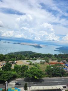 an aerial view of a parking lot and a lake at Pacific Staycation in Kaybagal