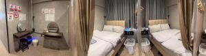 a small room with two beds and a mirror at Nonoteru Chiangmai in Chiang Mai