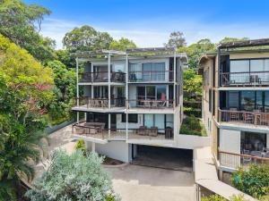 an aerial view of a building with balconies and trees at Cylinder Cove 9 in Point Lookout