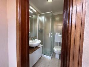 a bathroom with a toilet and a sink and a shower at La casa di Carlotta in Loano +37 photos
