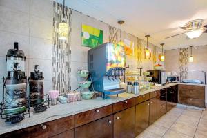 a restaurant kitchen with a counter with aperature at Quality Inn & Suites Live Oak I-10 Exit 283 in Live Oak