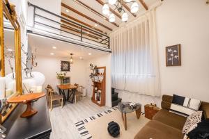 a living room with a couch and a table at Shanghai Hills&Well-time MCM Family loft Near Line2 and line13 West Nanjing Road in Shanghai