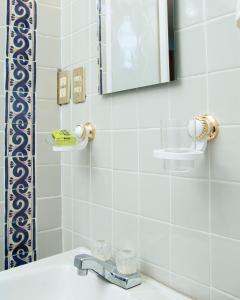 a bathroom with a sink and a mirror at Hacienda Casa de Piedra in Tlacolula de Matamoros