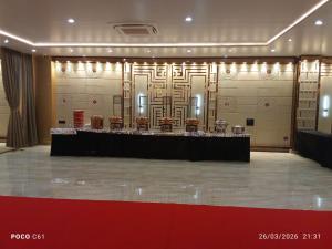 a large room with a table and some chairs at Shreeja Central in Bhawānipatna