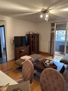 a living room with a couch and a tv at alisa in Srebrenik