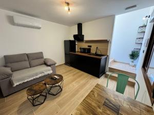 a living room with a couch and a table at Verde in Alcalá del Júcar +21 photos