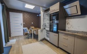 a kitchen with a table and a dining room at Luxury Home in Igal