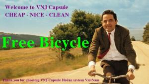 a man riding a bike down a road at VNJ Capsule 388 in Hoi An +25 photos