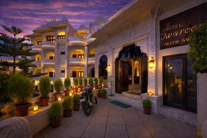 a building with motorcycles parked in front of it at Swaroop Vilas - Lake Facing Boutique Hotel in Udaipur +24 photos