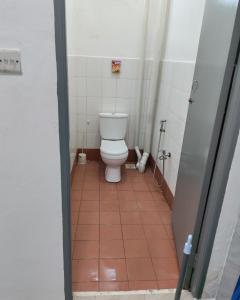 a small bathroom with a toilet in a stall at Cem Miri Homestay 2 in Miri