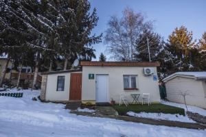 a small house in the snow in a yard at Home for two in Igal