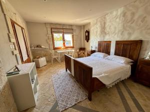 a bedroom with a large bed in a room at Affittacamere Agli Ulivi in Gemona del Friuli