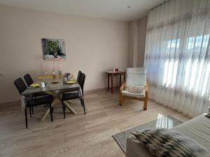 a dining room with a table and chairs in a room at Affittacamere Agli Ulivi in Gemona del Friuli