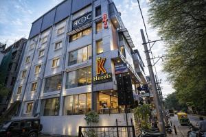 a building with a hudges sign in front of it at K Hotels by SYN in Bangalore