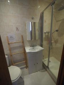 a bathroom with a sink and a shower and a toilet at Le Picaflor YourHostHelper in Hyères