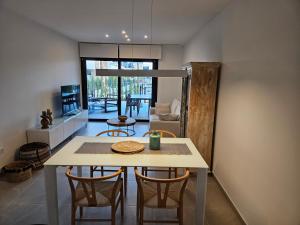 a dining room with a table and chairs in a room at Flamenca Village Resort apt 455 in Orihuela Costa
