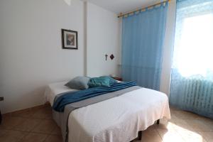 a bedroom with a bed and a window at Ayra's House Otranto in Otranto +37 photos