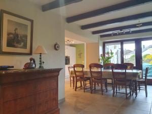 a kitchen and dining room with a table and chairs at Sur la Rive Vierre in Suxy +36 photos