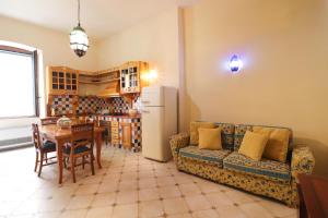 a living room with a couch and a table at Dimora Cariddi al Centro Storico in Otranto