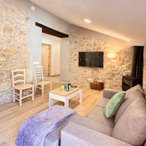 a living room with a couch and a table at Villa Jimena in Periana