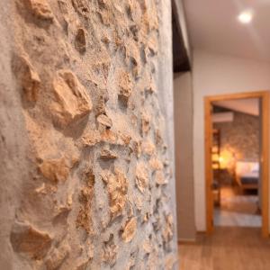 a stone wall in the hallway of a house at Villa Jimena in Periana +24 photos