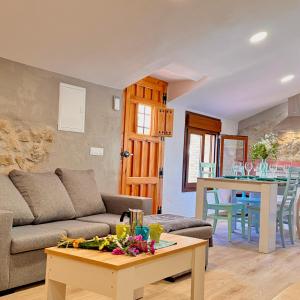 a living room with a couch and a table at Villa Jimena in Periana