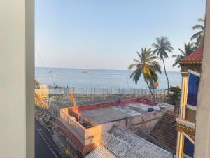 a view of the ocean from a building at EESHA Beach View Stay - Near Temple and Beach in Rāmeswaram