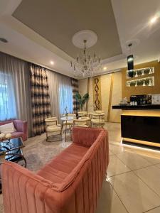 a living room with a couch and a dining room at Hotel Daytona Palace in Casoria