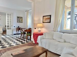 a living room with a white couch and a table at VILLA NORMA in Levanto