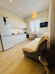 a kitchen with a bed and a refrigerator in a room at Kayani View in Taxiárkhai