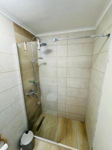 a shower with a glass door in a bathroom at Kayani View in Taxiárkhai +9 photos