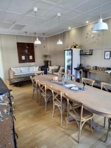 a large wooden table and chairs in a room at Pension Casa Simon in Treacastela