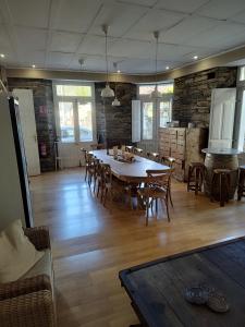 a large dining room with a table and chairs at Pension Casa Simon in Treacastela +18 photos