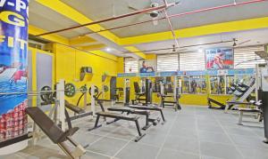 a gym with rows of treadmills and machines at Hotel Rama Hindustani in Jaipur