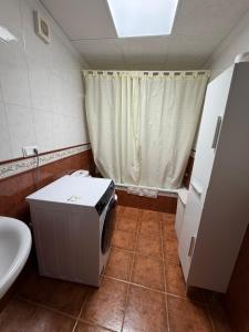 a small bathroom with a toilet and a sink at Casa Fuenteblanca in Liétor