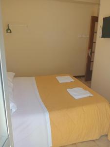 a bedroom with a bed with two towels on it at B&B Porta Roma in Capua