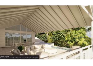 an architectural rendering of a living room with a white couch at Kindred Whitsundays in Cannonvale