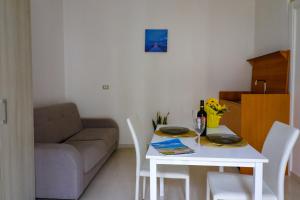 a living room with a table and a couch at Elaia's House in Cannole in Cannole +21 photos