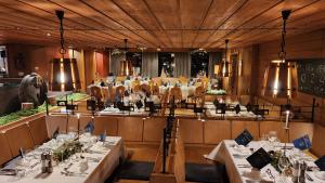 a dining room with tables and chairs in a restaurant at Speidel´s BrauManufaktur in Ödenwaldstetten
