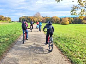 a group of people riding bikes down a trail at Speidel´s BrauManufaktur in Ödenwaldstetten +17 photos