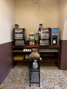 a room with a table with two printers on it at Albergo Diffuso Belvedere in Alice Bel Colle