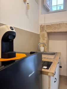 a kitchen with a mixer on a counter at Marbella house con jacuzzi in Polignano a Mare