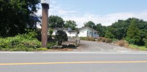 a house on the side of a road at Suijinhotel in Tochiya +9 photos