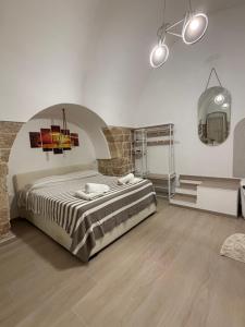 a bedroom with a large bed in a room at Marbella house con jacuzzi in Polignano a Mare