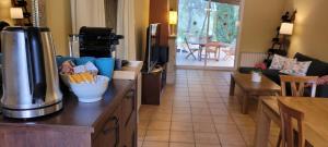 a kitchen with a counter with a coffee maker on it at Luxe Vista in Serra