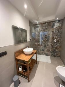 a bathroom with a sink and a shower at Ca' Bertera in Ledro +39 photos
